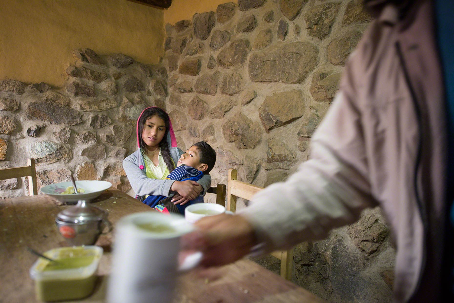 Té de Menta
Supported by his sister, Jose Antonio watches as his mother and father serve mint tea. 
